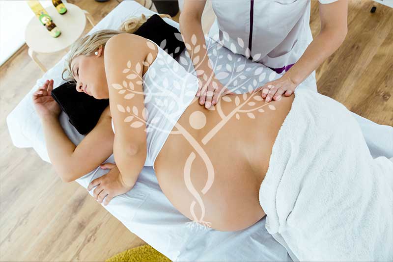 massaging the back of a pregnant woman